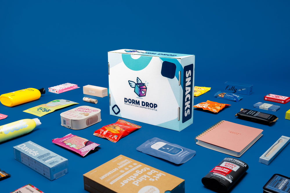 A flat-lay of the curated contents inside a Dorm Drop care package.