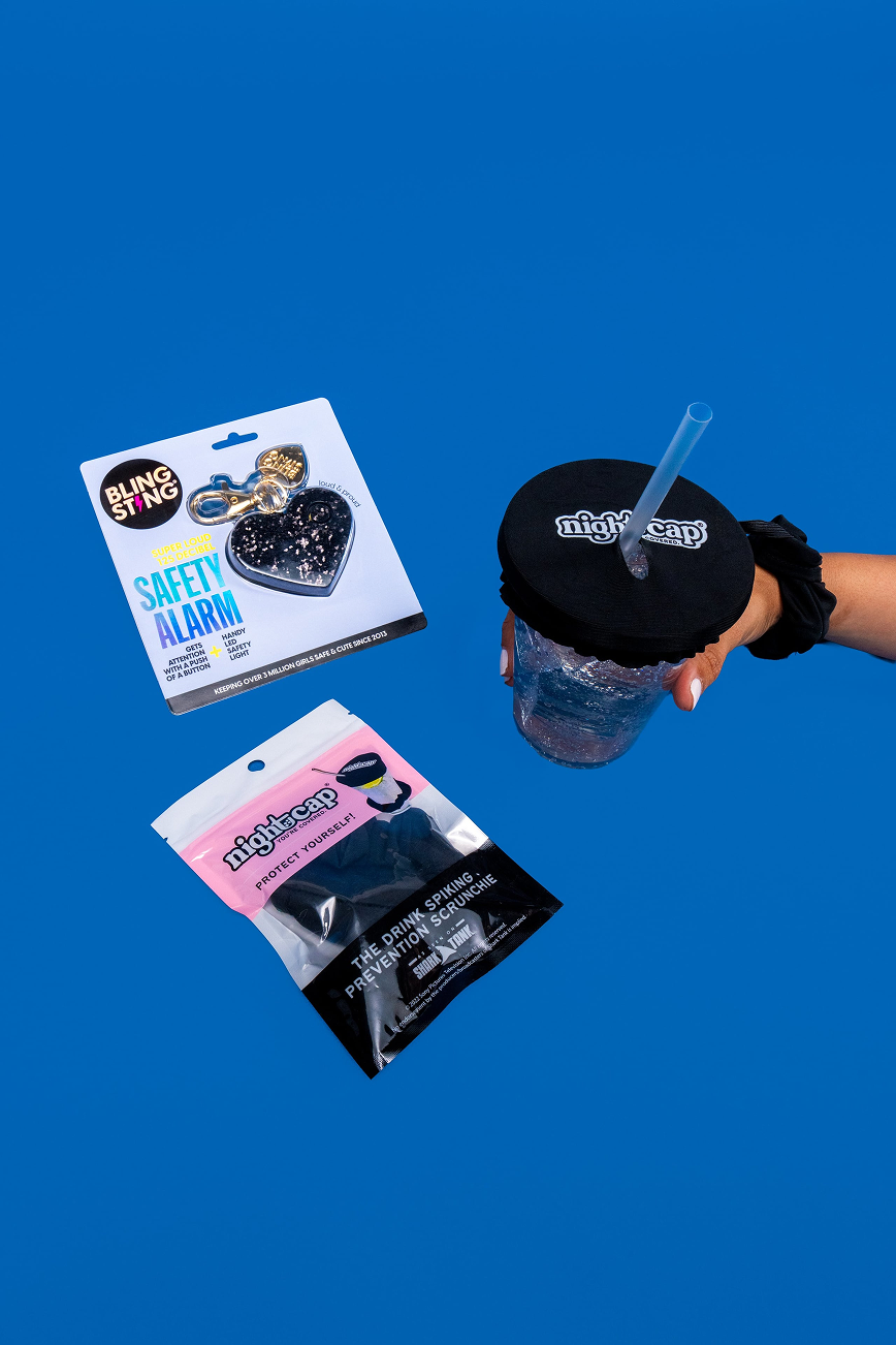 Safety Pack contents: a BlingSting personal safety alarm and a NightCap drink cover, shown over a cup